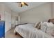 Cozy bedroom with neutral walls, ceiling fan and doorway to closet or bath at 133 Prominence Ct, Canton, GA 30114