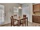 Cozy dining area with hardwood floors and a four-chair wooden table for intimate meals at 133 Prominence Ct, Canton, GA 30114