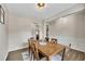 Stylish dining room with wood floors and wainscoting offering a lovely space for gathering at 133 Prominence Ct, Canton, GA 30114