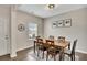 Charming dining area with wood floors and natural light, ideal for Gathering meals and entertaining at 133 Prominence Ct, Canton, GA 30114
