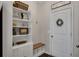 Inviting entryway featuring a built-in bench and shelving for organized storage at 133 Prominence Ct, Canton, GA 30114