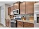 Featuring granite counters, stainless appliances and abundant cabinetry, this is a chef's delight at 133 Prominence Ct, Canton, GA 30114