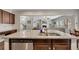 Granite countertops, a stainless dishwasher and double sink are a cook's dream in this spacious kitchen at 133 Prominence Ct, Canton, GA 30114