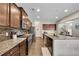 Modern kitchen featuring stainless steel appliances, granite countertops and wood flooring, perfect for culinary adventures at 133 Prominence Ct, Canton, GA 30114