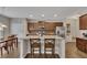 This kitchen island with seating, stainless appliances, and ample counter space make it ideal for entertaining at 133 Prominence Ct, Canton, GA 30114