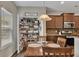 An open kitchen showcases a well-organized pantry and modern appliances for easy meal preparation at 133 Prominence Ct, Canton, GA 30114