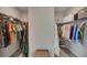 A roomy walk-in closet equipped with racks and shelves for plenty of clothing and storage at 133 Prominence Ct, Canton, GA 30114