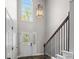 High-ceiling foyer featuring a staircase, slate tile flooring, and a large front door with sidelights at 2840 Ivy Mill Dr, Buford, GA 30519