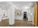 Open floor plan with the kitchen, stainless steel appliances, and a view of the hallway at 2840 Ivy Mill Dr, Buford, GA 30519