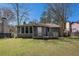 Backyard featuring a deck and screened porch at 910 Brandon Hill Way, Jonesboro, GA 30238
