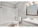 Clean bathroom featuring tub and shower, single sink vanity with ample lighting at 910 Brandon Hill Way, Jonesboro, GA 30238