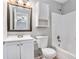 Cozy bathroom with a shower-tub combo, classic vanity, and storage at 910 Brandon Hill Way, Jonesboro, GA 30238