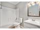 Clean, bright bathroom with shower-tub combo, modern fixtures, and ample vanity space at 910 Brandon Hill Way, Jonesboro, GA 30238