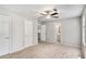 Spacious bedroom featuring a ceiling fan and ensuite bathroom access at 910 Brandon Hill Way, Jonesboro, GA 30238