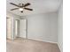 Bright bedroom with neutral carpet, a ceiling fan and ample closet space at 910 Brandon Hill Way, Jonesboro, GA 30238