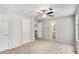 Spacious bedroom with ceiling fan and neutral carpet and paint, ready for personalization at 910 Brandon Hill Way, Jonesboro, GA 30238