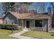 Charming single-Gathering home with stone accents, well-maintained lawn, and inviting front entrance at 910 Brandon Hill Way, Jonesboro, GA 30238