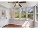 Bright sun room with multiple windows offering natural light and views of the backyard at 910 Brandon Hill Way, Jonesboro, GA 30238