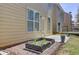 Backyard featuring a garden bed, a patio area with decorative pots, and access to a deck for outdoor enjoyment at 2205 Capella Sw Cir, Atlanta, GA 30331