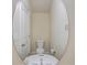 Powder room featuring a decorative mirror and white fixtures at 2205 Capella Sw Cir, Atlanta, GA 30331