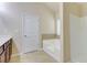 Bathroom showcases a large bathtub, window with blinds, and a white door at 2205 Capella Sw Cir, Atlanta, GA 30331