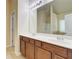 Well-lit bathroom featuring a double sink vanity, large mirror, and separate shower at 2205 Capella Sw Cir, Atlanta, GA 30331