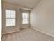 Empty bedroom featuring plush carpeting and two windows, great natural lighting at 2205 Capella Sw Cir, Atlanta, GA 30331
