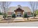 Attractive community clubhouse boasting a welcoming entrance, beautiful landscaping, and convenient parking at 2205 Capella Sw Cir, Atlanta, GA 30331