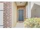 Close-up of the front entryway, showcasing a sturdy front door, brick accents, and a cozy porch at 2205 Capella Sw Cir, Atlanta, GA 30331