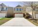 Charming two-story home featuring a two-car garage and manicured front lawn at 2205 Capella Sw Cir, Atlanta, GA 30331
