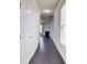 Bright hallway with hardwood floors leading to a cozy living area with fireplace at 2205 Capella Sw Cir, Atlanta, GA 30331
