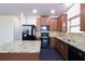 Well-appointed kitchen with stainless steel appliances, granite countertops, and center island at 2205 Capella Sw Cir, Atlanta, GA 30331