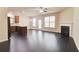 Spacious open-concept living room with hardwood floors, fireplace, and ample natural light at 2205 Capella Sw Cir, Atlanta, GA 30331