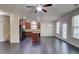 Open-concept living room and kitchen area with hardwood floors and plenty of natural light at 2205 Capella Sw Cir, Atlanta, GA 30331