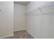 Empty walk-in closet with neutral carpet and metal shelving at 2205 Capella Sw Cir, Atlanta, GA 30331