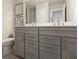 A spacious bathroom features a double vanity, sleek chrome fixtures and a neutral color scheme at 4256 Azalea Ridge Way, Hoschton, GA 30548