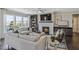 Cozy living room with a fireplace, plush seating, and large windows, creating a warm and inviting space to relax at 4256 Azalea Ridge Way, Hoschton, GA 30548