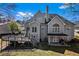 Charming home backyard featuring a spacious deck and a covered patio, perfect for outdoor entertaining at 525 James Lee Dr, Suwanee, GA 30024