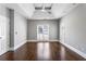 Bright bedroom with large windows offering natural light and polished hardwood floors at 525 James Lee Dr, Suwanee, GA 30024