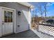 Outdoor deck with an exterior door and light, perfect for enjoying the scenery and the surrounding landscape at 525 James Lee Dr, Suwanee, GA 30024