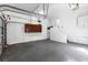 Spacious garage featuring clean walls, visible ceiling hardware, and ample room for parking and storage at 525 James Lee Dr, Suwanee, GA 30024