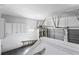 Clean garage featuring storage cabinets, shelving, and multiple garage doors for convenient access at 525 James Lee Dr, Suwanee, GA 30024