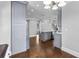 Bright kitchen features white cabinetry, stainless steel appliances, and a large island with granite countertops at 525 James Lee Dr, Suwanee, GA 30024