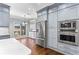 Spacious kitchen features gray cabinetry and stainless steel appliances, including a built-in microwave at 525 James Lee Dr, Suwanee, GA 30024