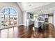 Open-concept kitchen features gray cabinetry, white countertops and modern stainless steel appliances at 525 James Lee Dr, Suwanee, GA 30024