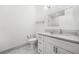 Bright bathroom with granite countertop, modern fixtures, and a tiled floor at 5300 Peachtree Rd # 1212, Atlanta, GA 30341