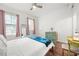 Stylish bedroom with dresser, ceiling fan, and natural light at 5300 Peachtree Rd # 1212, Atlanta, GA 30341