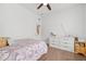 Bedroom with wooden floor, a ceiling fan and dresser with multiple drawers at 5300 Peachtree Rd # 1212, Atlanta, GA 30341