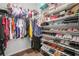 Organized walk-in closet with shelving filled with clothes, shoes, and accessories at 5300 Peachtree Rd # 1212, Atlanta, GA 30341