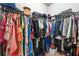 Walk-in closet with shelving, clothing racks, and various personal items at 5300 Peachtree Rd # 1212, Atlanta, GA 30341